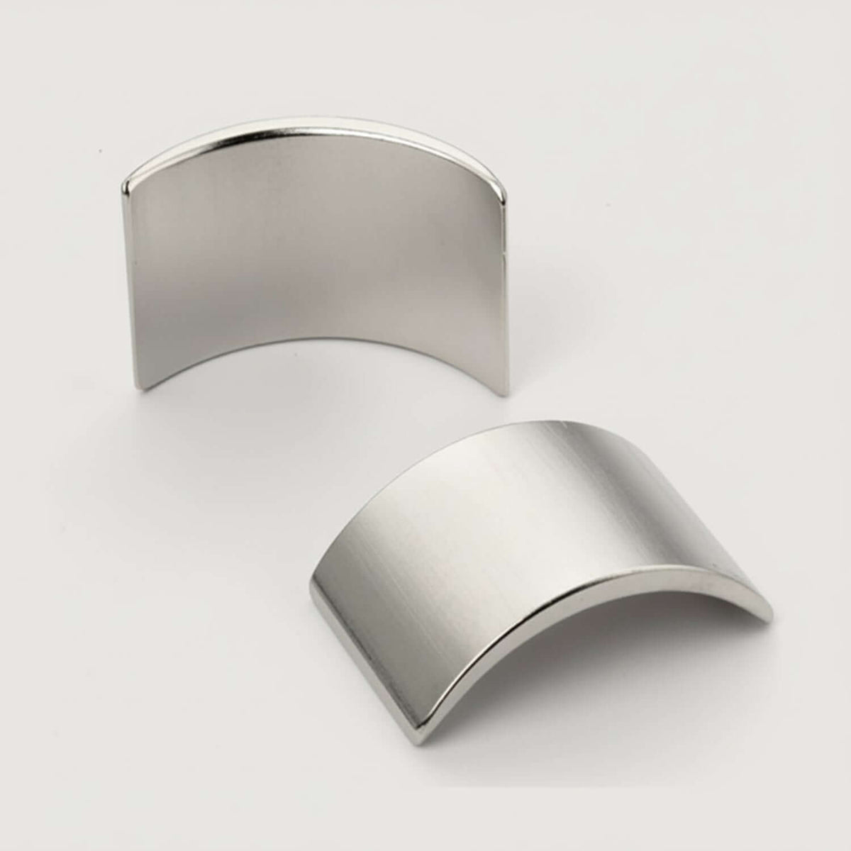 Graphene SPION Trap components showing two curved metallic pieces for magnetic immobilization.