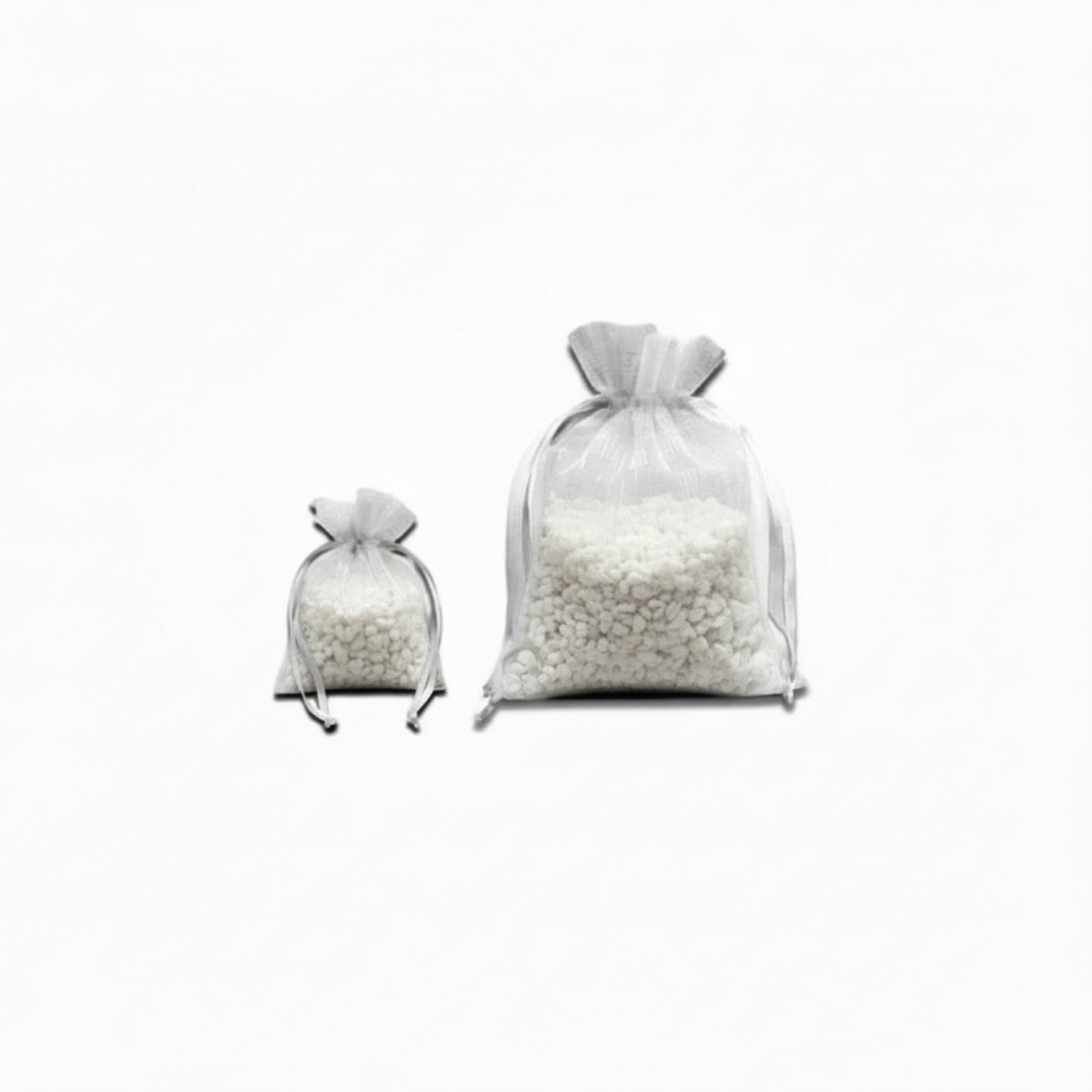 Two white satchels full of small white 'rocks' on a white background