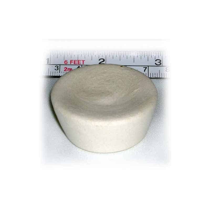 Round ivory cupcake-shaped device with a ruler showing its size on a white background