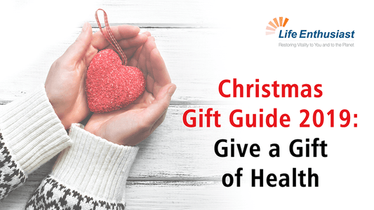 Hands holding a heart with text Christmas Gift Guide 2019: Give a Gift of Health.