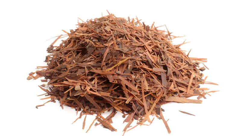Pau D'Arco herbal bark in a pile, showcasing its natural shredded texture.