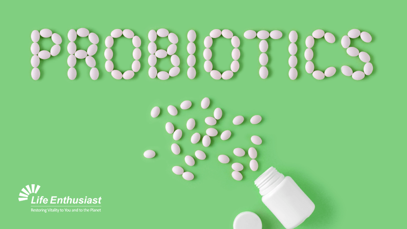 Probiotics from Soil-Based Organisms spelled out with white tablets on a green background.