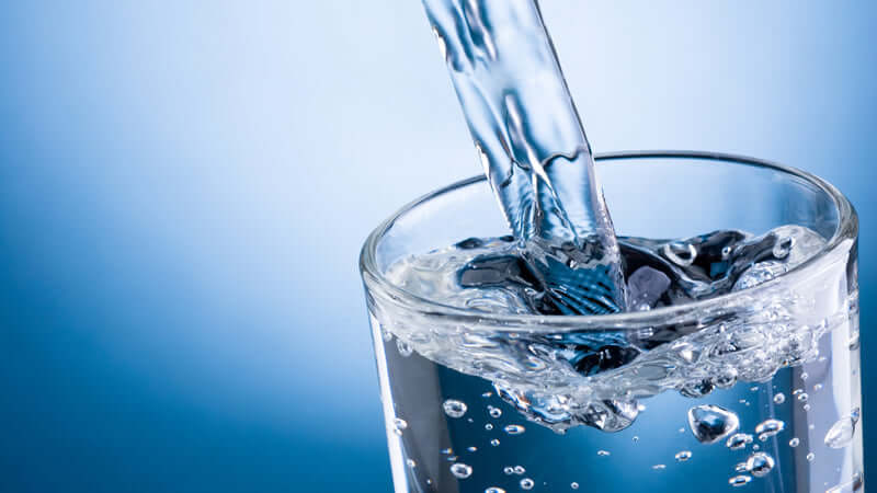 Pure Water and Pure Consciousness - a close-up of water being poured into a glass.