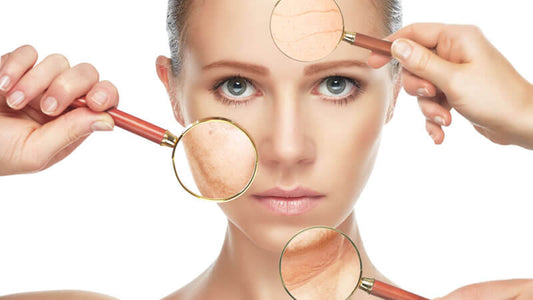 Close-up of a woman's face examining skin inflamed conditions with magnifying glasses.