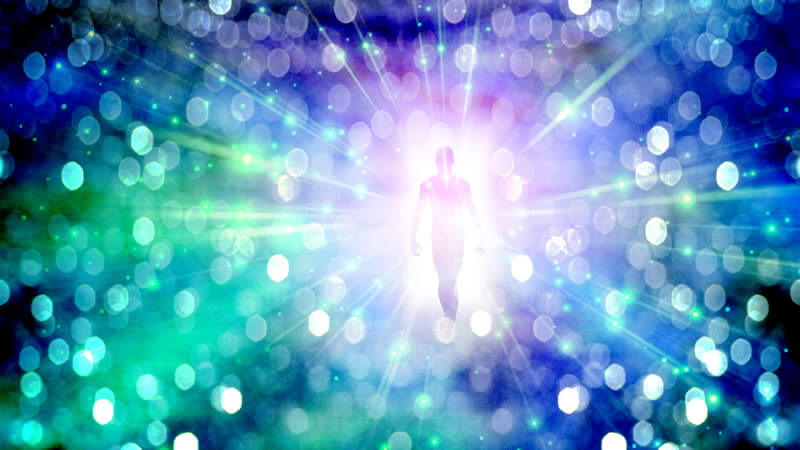 A figure walking towards a light source symbolizing ORMUS and Spiritual advancement.
