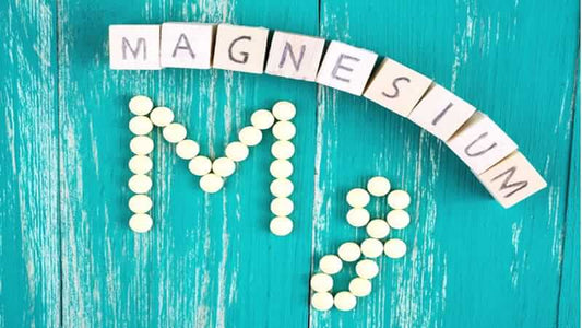 Magnesium and Cellular Vitality with tablets and letters spelling magnesium on a vibrant blue background.