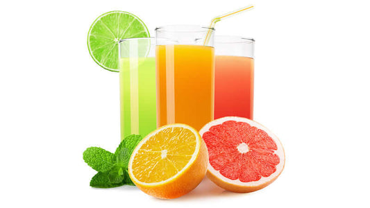 Importance of Fresh Juices with colorful beverages and fresh fruit slices arranged attractively.