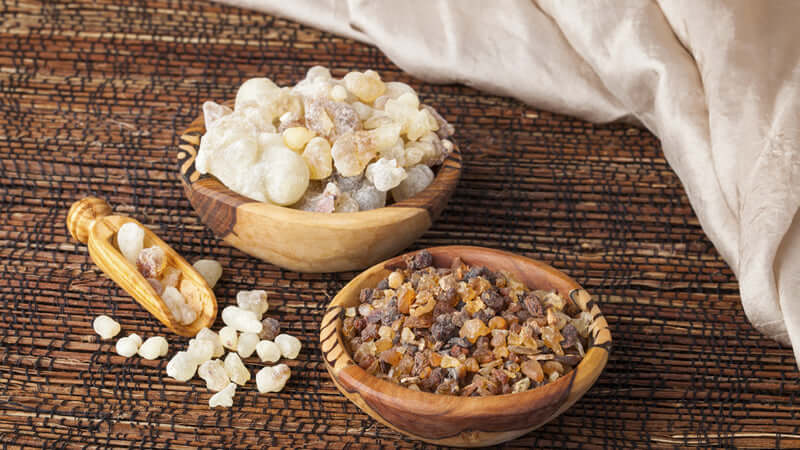 Bowls filled with resin and substances related to ORMUS and the Bible, showcasing natural ingredients.