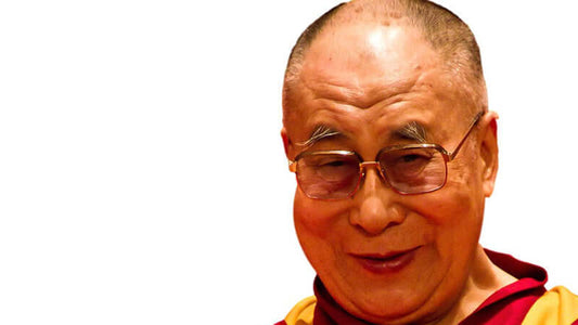 Dalai Lama on Compassion smiling warmly during a public talk about kindness and empathy.