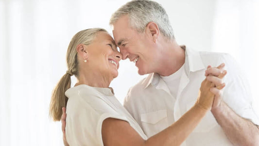Happy couple dancing together, showcasing love and relationships, embodying joy and connection.