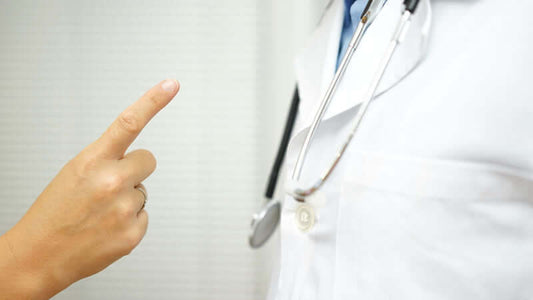 A doctor in a white coat with a stethoscope, illustrating the concept of why doctors don't change their opinion.