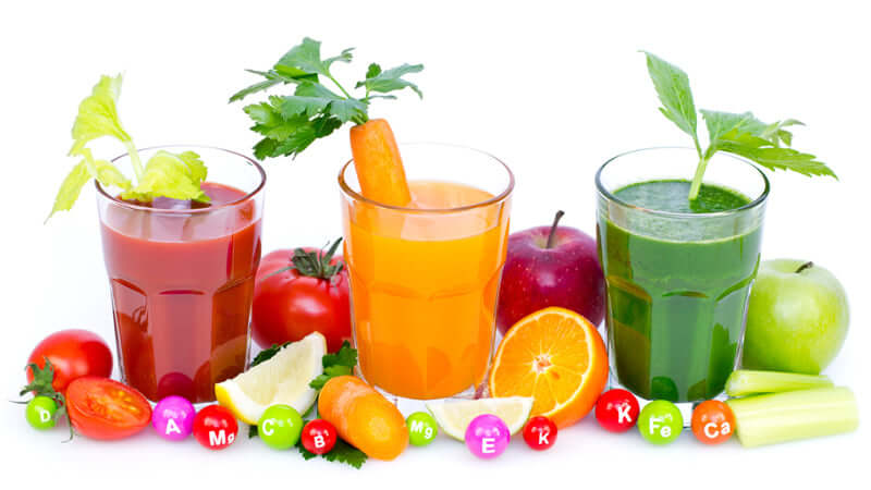 Scientific Research Exsula Superfoods Ingredients featured in colorful juices with fresh fruits and vegetables.