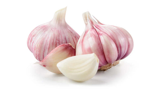 Fresh garlic bulbs and cloves showcasing different varieties of garlic.