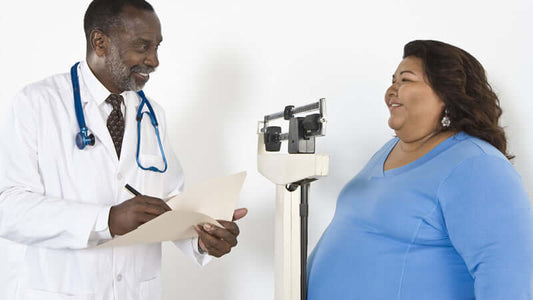 Doctor discussing weight management with patient addressing Correct Estrogen Excess and Obesity.