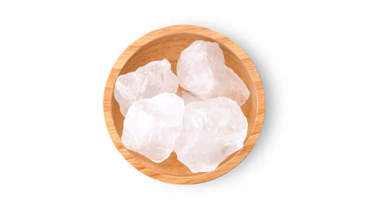 Minerals and Trace Elements in Crystal Salt in a wooden bowl with crystal salt pieces.