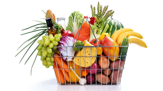 A basket filled with fresh fruits and vegetables representing healthy eating for Cancer Treatment from The Cancer Tutor.