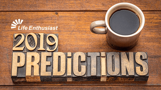 2019 Predictions displayed in vintage letters with a coffee mug on wooden table background.