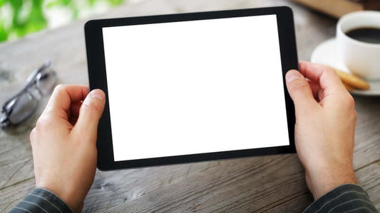 Person holding a tablet with a blank screen, representing the theme of Not Seeing Is Believing.