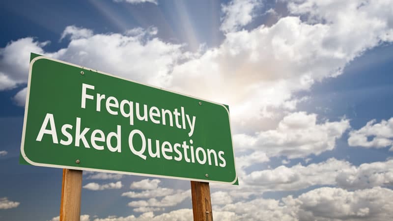 Signpost displaying the text 'Frequently Asked Questions' against a cloudy sky, embodying 'Fun with Frequently Answered Questions'.