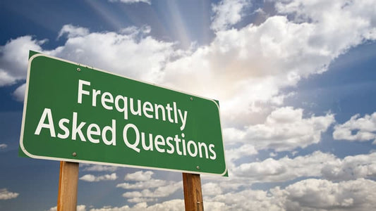 Signpost displaying the text 'Frequently Asked Questions' against a cloudy sky, embodying 'Fun with Frequently Answered Questions'.