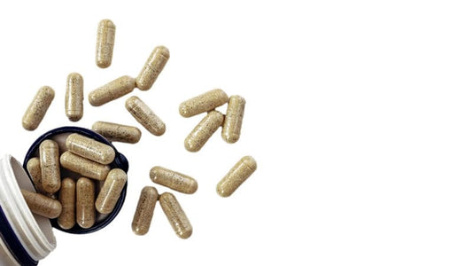 A bottle spilling capsules, representing the topic of Individual Enzymes Basics.
