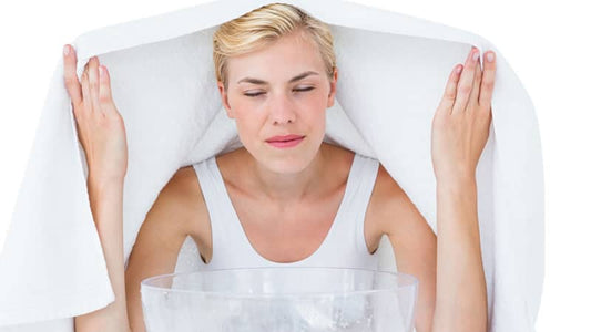 Woman using steam therapy for relief, highlighting the benefits of salt for health, particularly in Salt Eases Cystic Fibrosis.