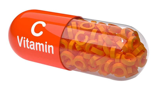 Colorful Vitamin C capsule filled with vitamin letter supplements, emphasizing Vitamin C and Cancer.