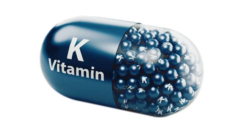 Vitamin K Basics: blue vitamin K capsule containing small beads, illustrating the importance of Vitamin K.