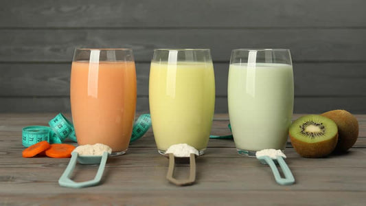 Three glasses of whey protein shakes in different colors, highlighting the benefits of Whey Protein.