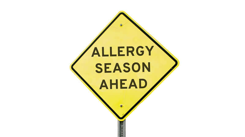 Caution sign indicating Allergy Season Ahead, highlighting the arrival of Allergy Season Relief.