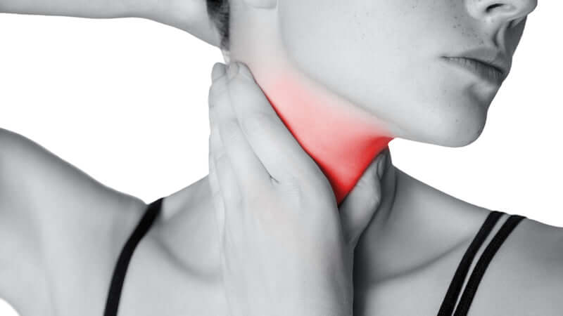 Person showing discomfort in the neck, related to Magnesium and Iodine Deficiency.