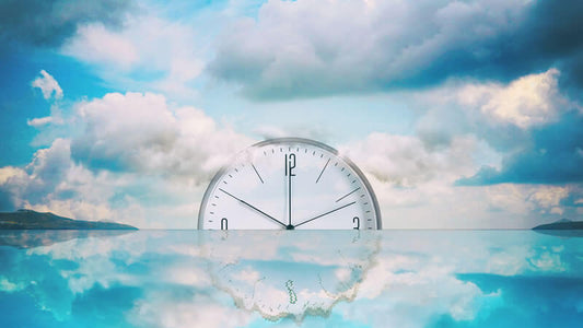 Water Memory Interview with Dr. Ludwig visualized with a clock in a serene sky and water reflection.