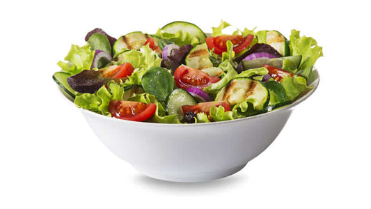A fresh salad bowl showcasing the vibrant colors and ingredients, highlighting Raw Food Benefits for healthy eating.
