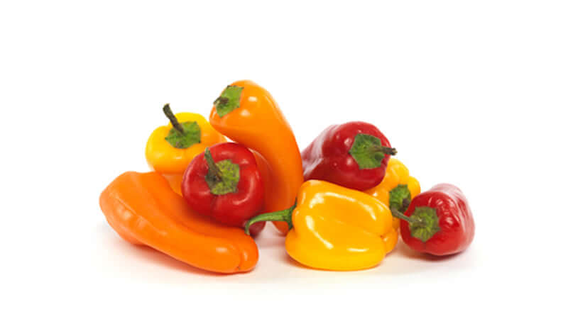 Colorful assortment of peppers including cayenne, capsicum, and paprika varieties.