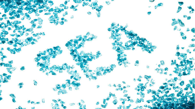 Chelated Minerals represented by blue crystals on white background, showcasing their vibrant appearance.