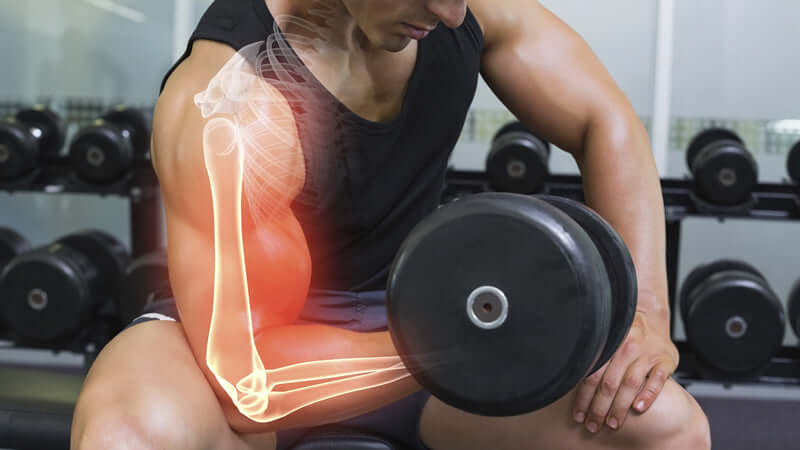 Wonders of Magnesium: A weightlifter demonstrating arm strength and muscle engagement with a dumbbell.