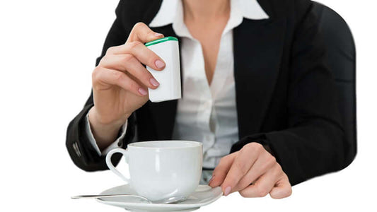A person adding a sweetener to a cup of coffee, discussing why aspartame is poison.