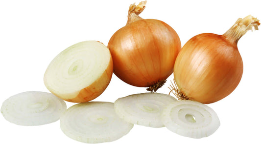 Onions placed beside sliced onions, showcasing the different layers and textures of this versatile vegetable.