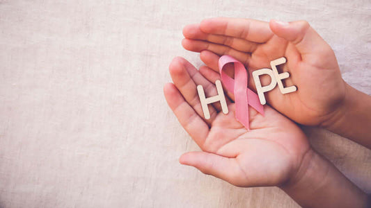 Surviving Breast Cancer with Kay Lam - hands holding 'HOPE' letters and a pink ribbon symbol.