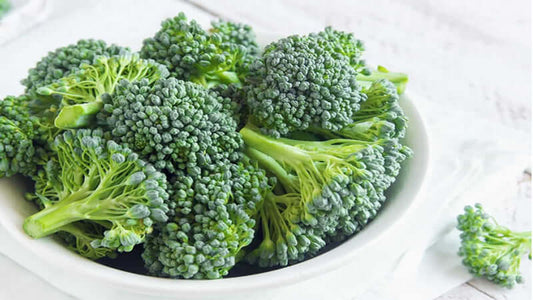 Fresh green Broccoli in a white bowl ready for culinary use or healthy eating.