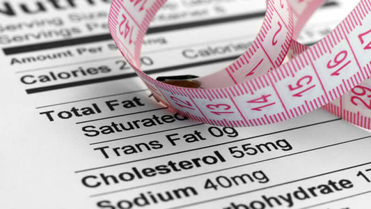 Cholesterol Specific Nutritional Approach nutrition label with measuring tape highlighting cholesterol levels.