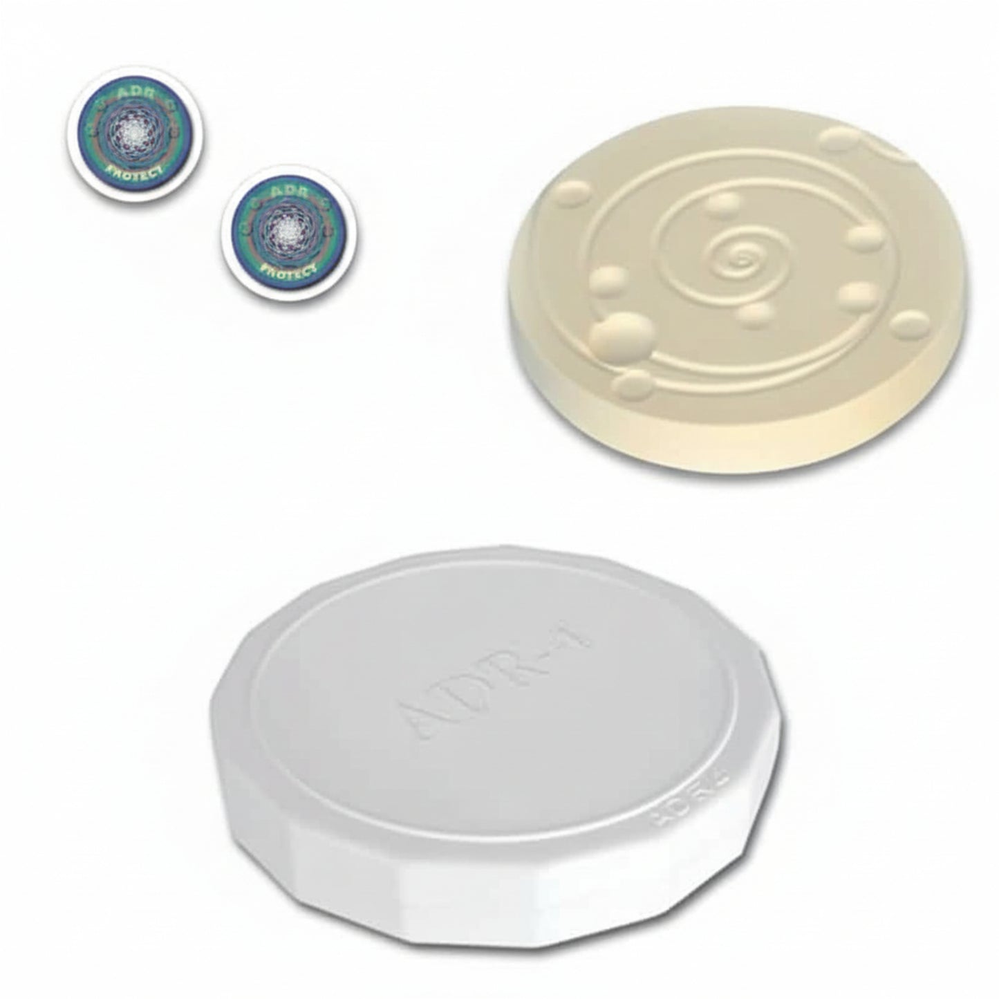3 different round products, two stickers ADR Protect with swirling pattern, one ADR-3 ivory ceramic disk with swirling pattern, and one ADR-4 white disk