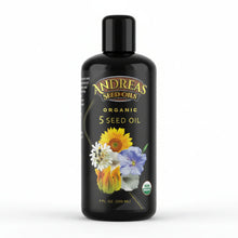 bottle of Andreas Seed Oils Organic 5 Seed Oil 7oz with floral design on a white background