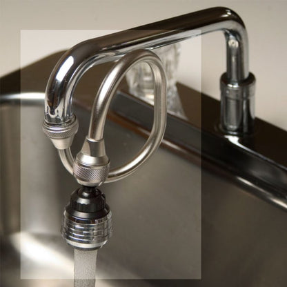 Chrome kitchen faucet with a water filter attachment on a sink.
