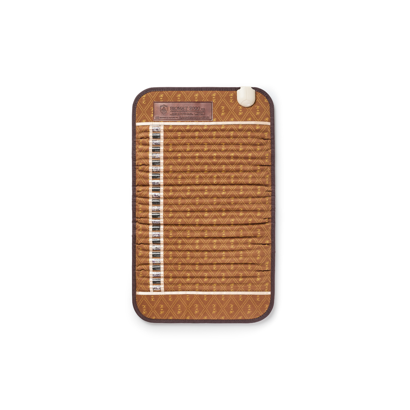 A brown woven fabric strap organizer with a diamond pattern, featuring multiple horizontal straps, a white vertical loop on the left, and a white snap button on the top right.