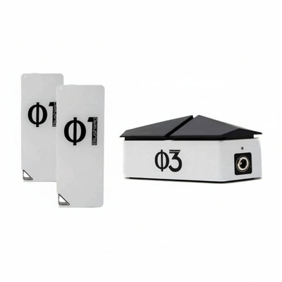 three white devices for EMF protection, two look like cell phones and say Φ1 Blushield, the other has a black top like a roof and says Blushield Φ3