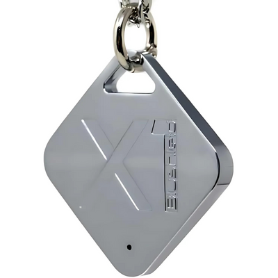 Silver keychain device with a logo on a white background