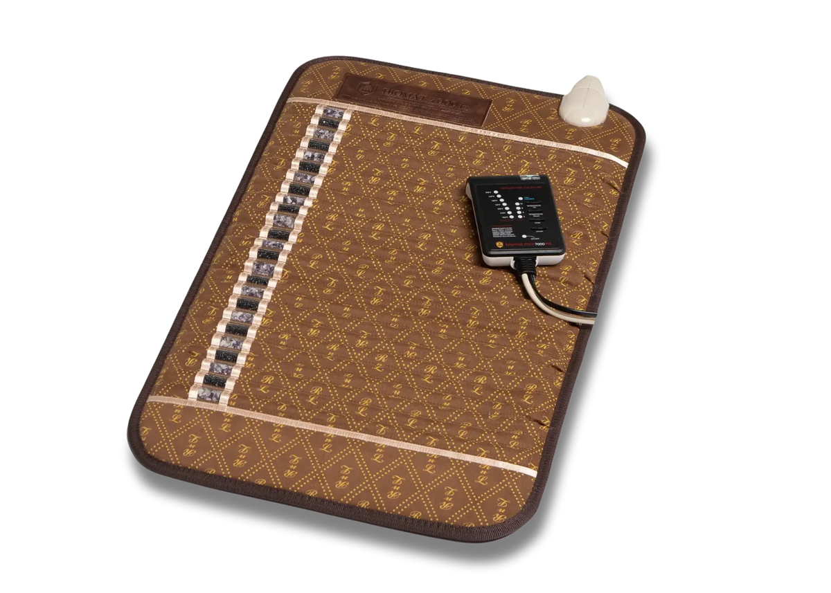 A brown heated massage pad with a geometric pattern, featuring a built-in temperature controller and a white cooling vent, shown on a white background.