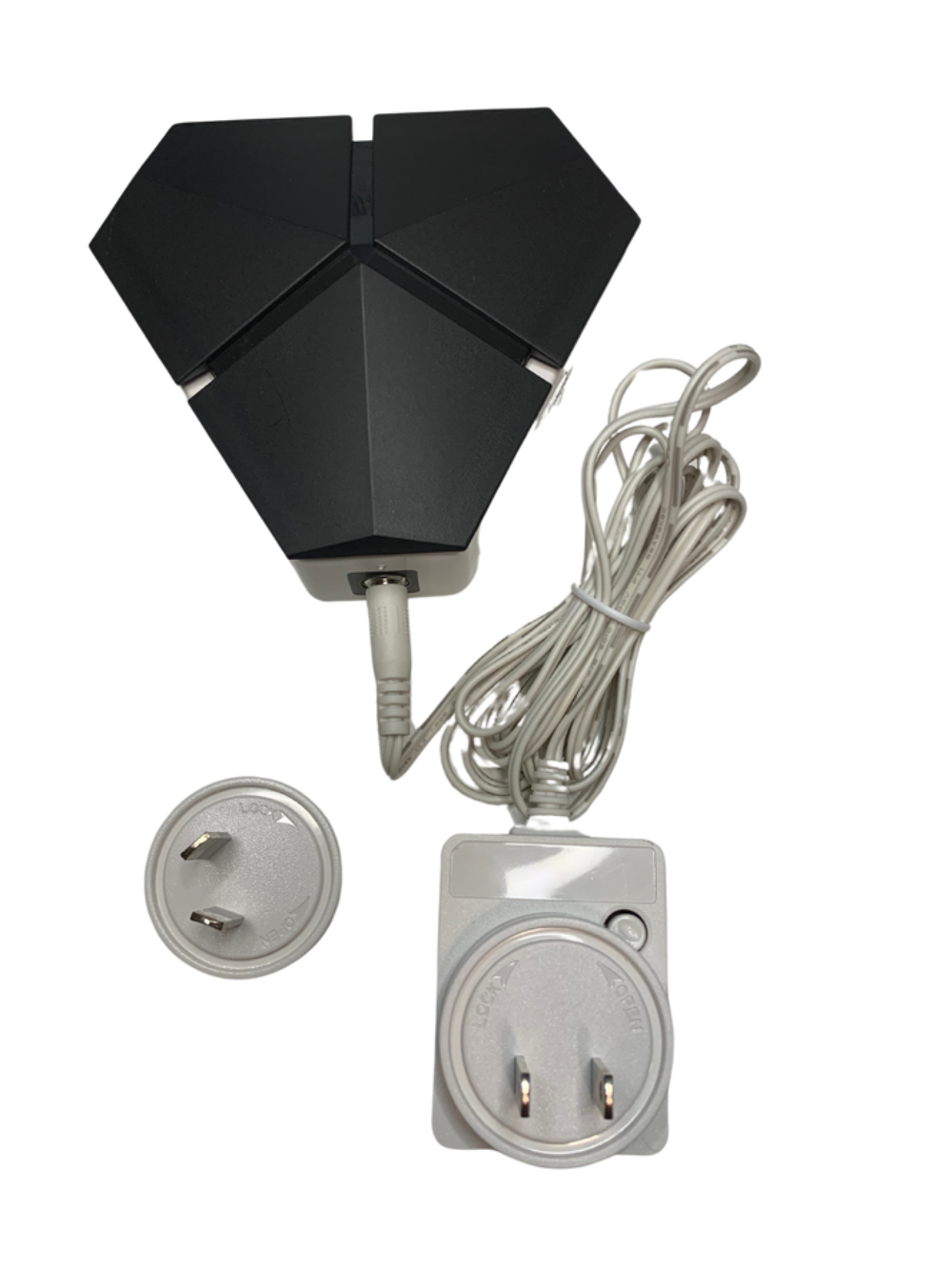 Black outdoor light fixture with power cord and plugs on a white background