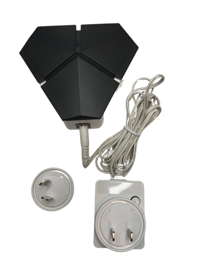 Black outdoor light fixture with power cord and plugs on a white background